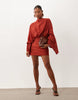 Petite Cape Sleeve Open Back Mini Dress With Tassels In Rust