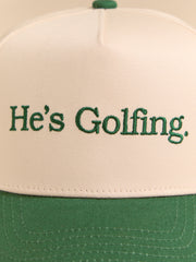 He's Golfing Trucker Hat