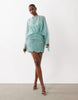 Caped Open Back Mini Dress With Embellished Skirt In Turquoise